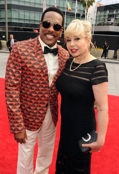 Last Name, Wilson - Cadillac Lifetime Achievement Award honoree Charlie Wilson goes for a bold print on his blazer while posing with his wife, Mahin Tat.&nbsp;   (Photo: Kevin Winter/BET/Getty Images for BET)