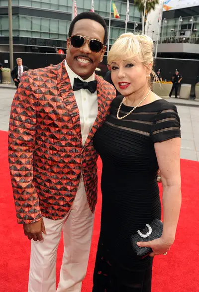Last Name, Wilson - Cadillac Lifetime Achievement Award honoree Charlie Wilson goes for a bold print on his blazer while posing with his wife, Mahin Tat.&nbsp;   (Photo: Kevin Winter/BET/Getty Images for BET)