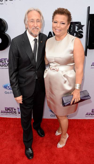 Follow the Leader - Debra Lee, Chairman and Chief Executive Officer of BET, goes for a chic look in a Louis Vuitton empire waist dress and strappy Louboutins while posing with the President of the National Academy of Recording Arts and Sciences, Neil Portnow.   (Photo: Jason Merritt/BET/Getty Images for BET)
