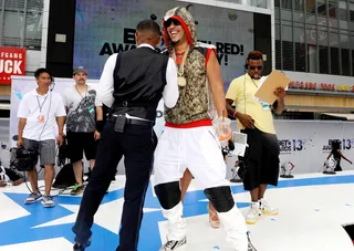 Python French  - Just in case you were wondering, that's definitely a full-on snake adorning French Montana's hoodie. New trend or what?  (Photo: John Ricard/Getty Images for BET)