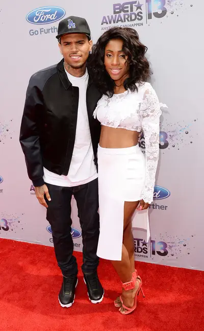 Veteran and Newcomer - Singer Chris Brown keeps it simple, while his new artist Sevyn Streeter brings the glam in all white.   (Photo: Jason Merritt/BET/Getty Images for BET)