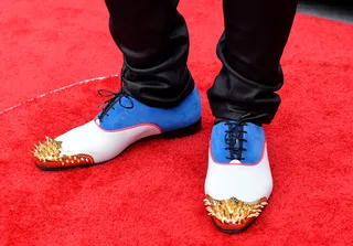 Look Down - Always one to make a fashion statement, Trinidad James rocks these two-tone shoes with golden spikes.  (Photo: Alberto Rodriguez/BET/Getty Images for BET)