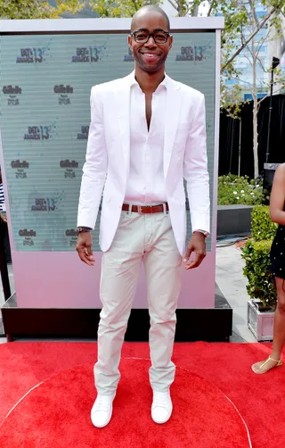 Sneaker Head - Jay Ellis goes for all white and Saint Laurent sneakers. The Game actor said he gets ready in 10 to 15 minutes and doesn't understand why it takes the ladies so much time to get their hair done.  (Photo: Alberto Rodriguez/BET/Getty Images for BET)