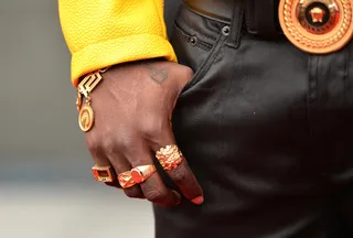 Ring Leader - Trinidad James' neck, wrists and fingers are all lavishly decked in gold jewelry.  (Photo: Alberto Rodriguez/BET/Getty Images for BET)