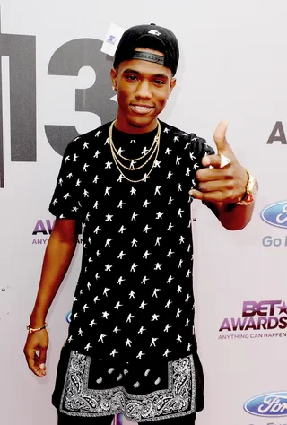 Black on Black - B. Smyth keeps it fresh in a fly top, gold accessories and his hat to the back.  (Photo: Kevin Winter/BET/Getty Images for BET)