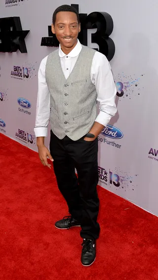 Tee Tee - The Game's favorite sidekick, Barry Floyd, hits the carpet in a buttoned-up look: a simple vest, crisp white top and jeans.  (Photo by Jason Merritt/BET/Getty Images for BET)