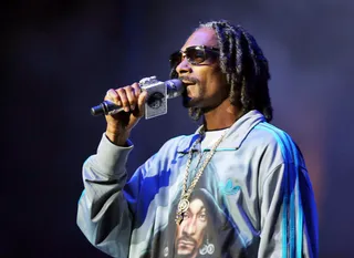 WELCOME TO THE DOG HOUSE - Snoop Dogg, a.k.a. Snoop Lion, stands on the no-guns platform, so he brought a different kind of ammunition to the Staples Center stage: An arsenal full of West Coast classics.(Photo: Chelsea Lauren/Getty Images for BET)