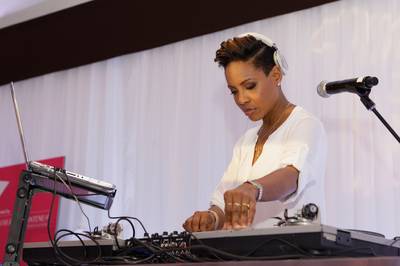 The P&amp;G Beauty Lounge: MC Lyte DJs - Legendary rapper and DJ MC Lyte was on the 1's and 2's in the beauty lounge, where lucky guests were treated to makeovers, manicures and swag!(Photo: Mike Windle/Getty Images for BET)