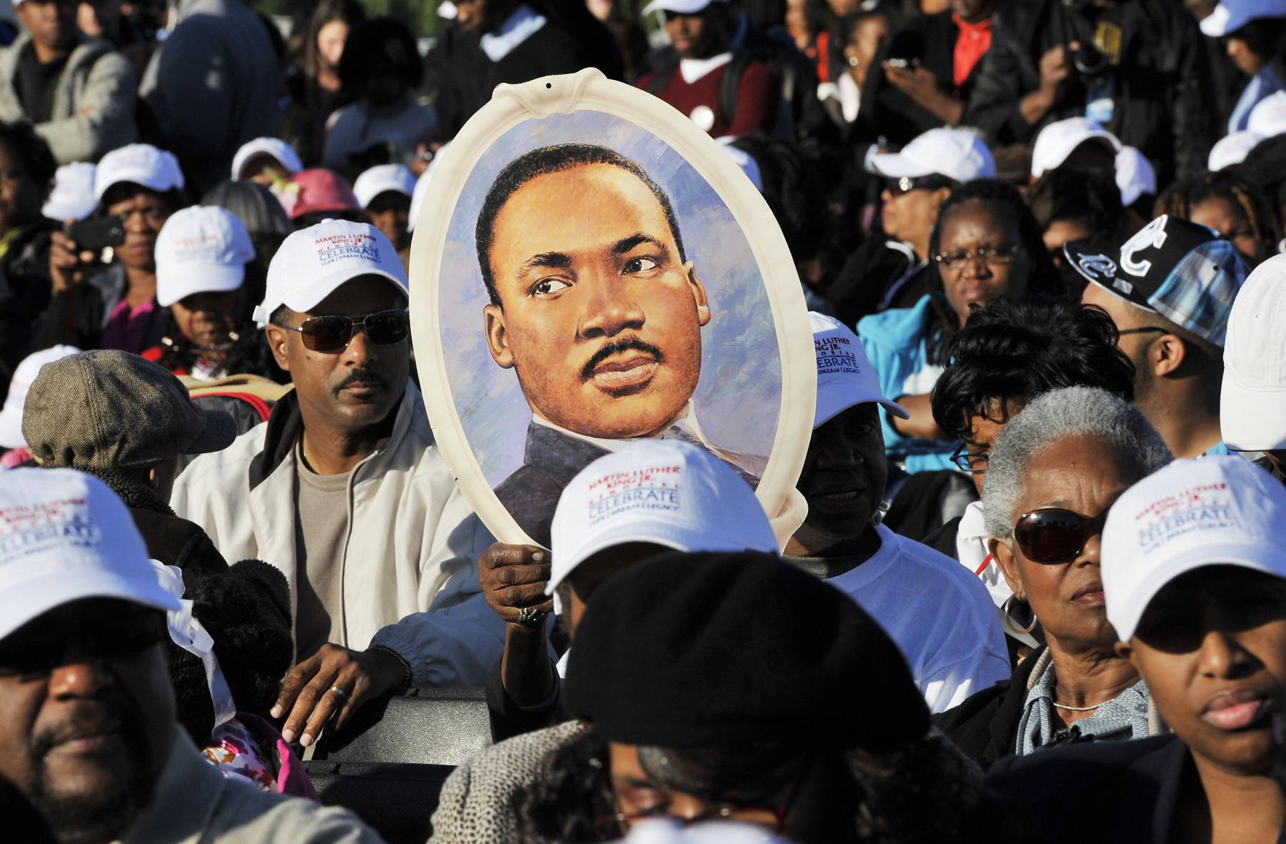 A Homemade Symbol of Peace - People hold up a poster of King.(Photo: MLADEN ANTONOV/AFP/Getty Images)
