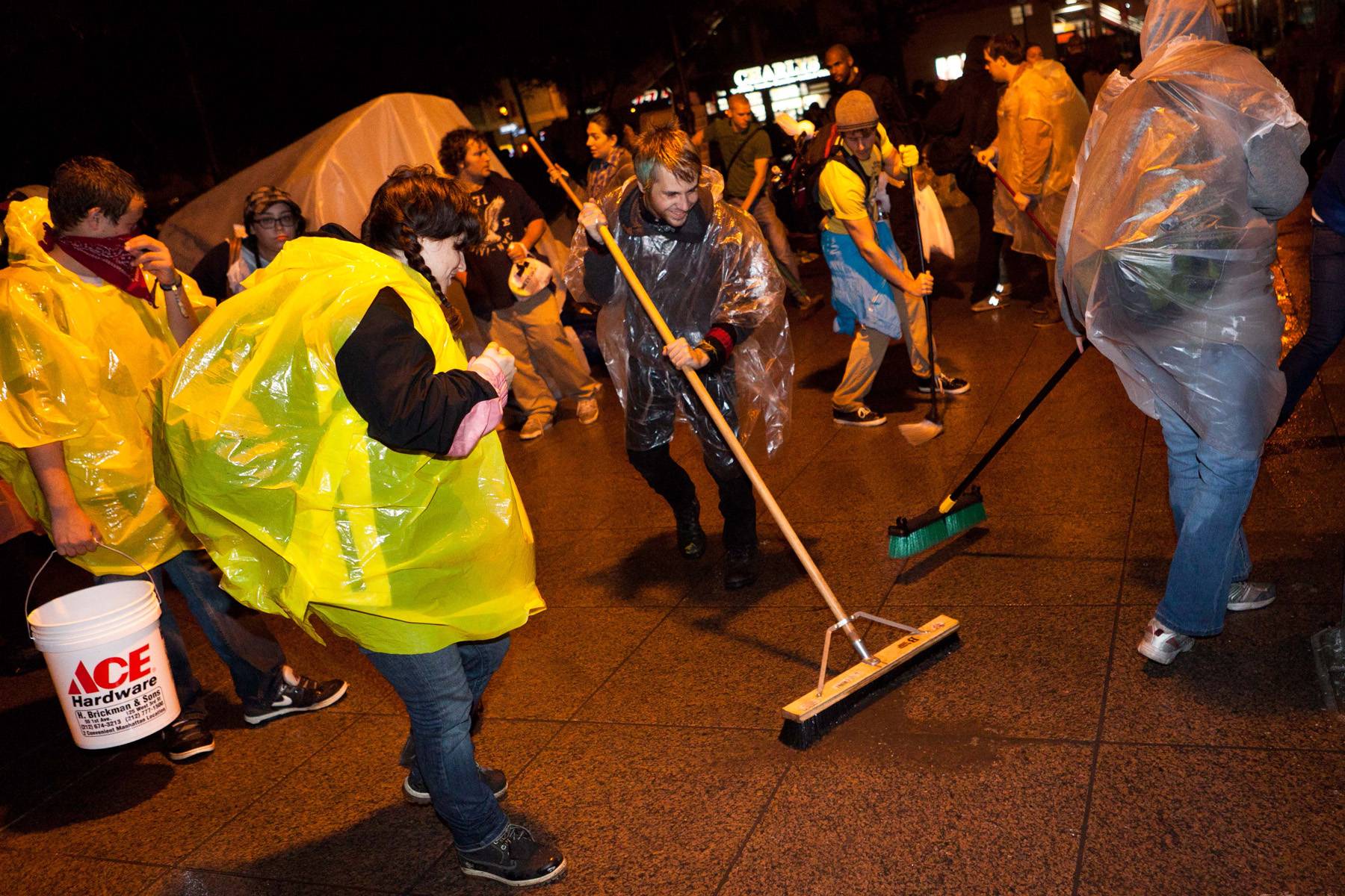 Occupy Wall Street Protesters Skirt Shutdown With Clean Up  - Facing a temporary shutdown for routine cleaning of Manhattan’s Zuccotti Park Thursday, Oct. 13, Occupy Wall Street protesters were told by the city that they could remain in the park after about 600-700 protesters banded together and cleaned up the mess themselves.(Photo: AP Photo/John Minchillo)