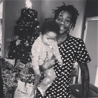 Wiz Khalifa @mistaercap - &quot;Best gift ever.&quot; Wiz makes baby Bash's first Christmas unforgettable. Look at all those presents under the tree!(Photo: Wiz Khalifa via Instagram)