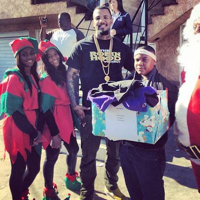 Game - We’re giving major props to the Compton-bred rapper, who donated $10,000 worth of toys and goods to families in need through his Robin Hood Project. Just another reason why he made our list of top celebrity givers of 2013! (Photo: Game via Instagram)
