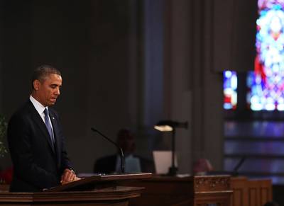 Healer-in-Chief - A saddened Obama pauses while speaking at an interfaith prayer service for victims of the Boston Marathon. &nbsp;  (Photo: Spencer Platt/Getty Images)