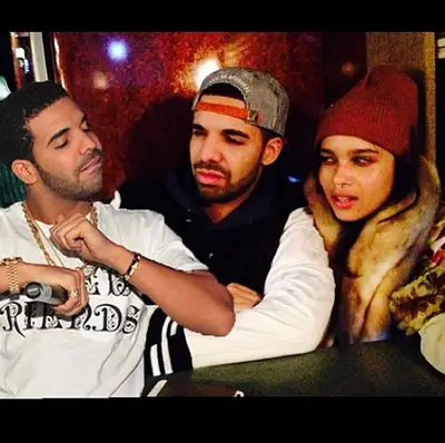 Drake @champagnepapi - Three's a definitely a crowd. Drake and Zoe Kravitz give Drizzy's alter ego the side eye in this funny pic he edited. The actress and the&nbsp;Nothing Was the Same&nbsp;rapper look extra comfy together, adding fuel to the rumors that they're dating.(Photo: Drake via Instagram)