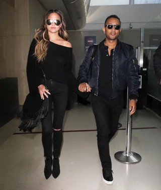 Back in Black - John Legend and Chrissy Teigen arrive at LAX sporting matching all-black outfits.(Photo:&nbsp;WENN.com)