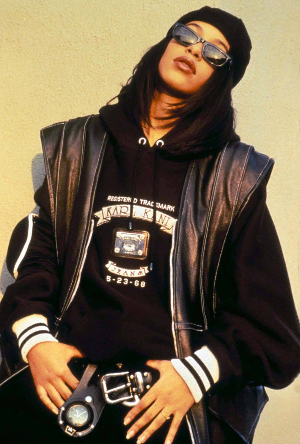 Crazy, Sexy, Cool - Even in her tomboy gear, Aaliyah had a confident allure. Rather than disappearing in the oversized jersey, shades and baggy jeans, there was mystery that drew fans in and made you want to know more. (GLOBE PHOTOS, INC)