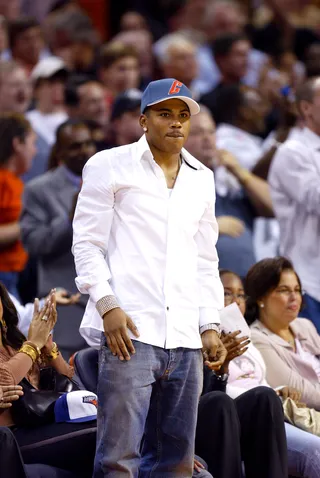 Courtside (2005) - Fun fact: Nelly was a minority owner in the Charlotte Bobcats (now known as the Charlotte Hornets). Here he is at a 2005 game (when they were still the Bobcats) looking as if he needs his team to HUSTLE. (Photo: Craig Jones/Getty Images)&nbsp;