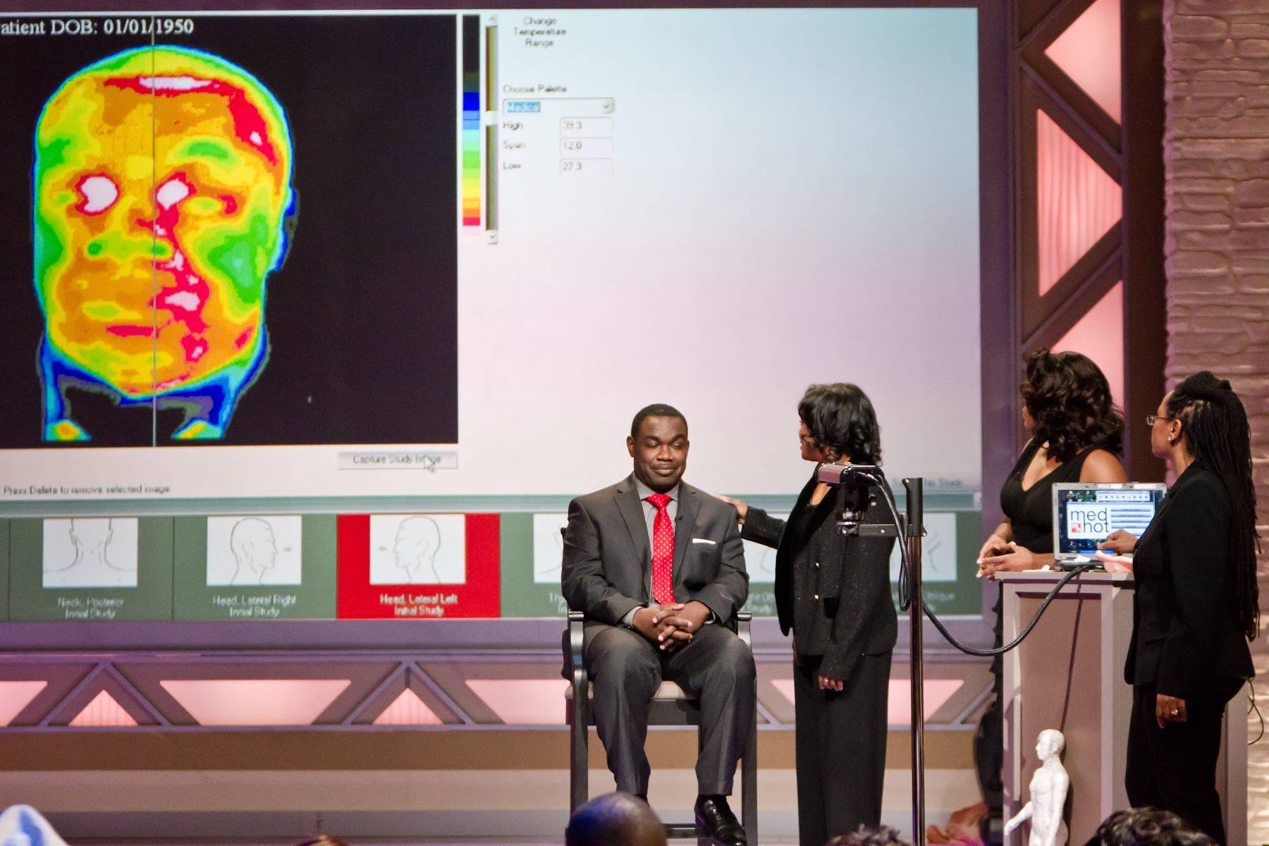 In Action - Dr. Robbins sets up Rodney on a thermography machine to show the audience what she does in practice.(Photo: Darnell Williams/BET)