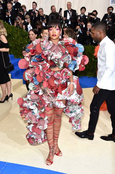 2017:&nbsp;Rei Kawakubo: Art Of The In-Between - At the 2017 MET Gala, Rihanna&nbsp;showed off her playful side in a ruffled Comme des Garçons dress with lace-up heels.&nbsp;(Photo by John Shearer/Getty Images) (Photo by John Shearer/Getty Images)