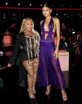 BET Awards 2021 - Stylist&nbsp;Law Roach&nbsp;has done it, again! Last night,&nbsp;Zendaya&nbsp;created an iconic moment at the BET Awards 2021 when she seized the opportunity to pay homage to&nbsp;Beyoncé.&nbsp;ICYMI:&nbsp;The&nbsp;Euphoria&nbsp;actress showed up to the star-studded event in a flowing two-tone Versace gown and snapped this photo with legendary rapper, Lil' Kim. If the dress looks familiar, then you have a great memory. Back in 2003, Beyoncé wore a shorter version of the look while performing “Crazy In Love” at the 2003 ceremony. So iconic!&nbsp; (Photo: Bennett Raglin/Getty Images for BET)