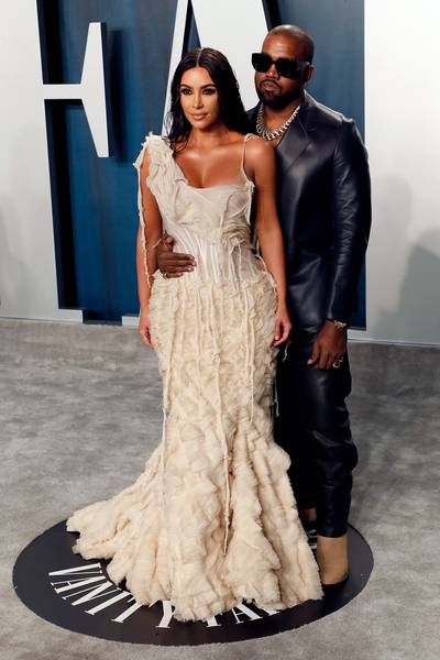 Kim Kardashian&nbsp;and&nbsp;Kanye West - Kim Kardashian and Kanye West are bringing the heat to the Vanity Fair Oscar Party. Kim looks amazing in a cream Alexander McQueen gown, while her hubby Kanye went for a leather look by Dunhill.(Photo by Taylor Hill/FilmMagic) (Photo by Taylor Hill/FilmMagic)
