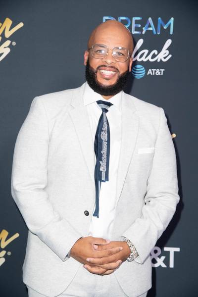 James Fortune snapped a photo wearing his ice grey suit and bold Christian Dior tie. - (Photography By Gip III for Central City Productions) (Photography By Gip III for Central City Productions)