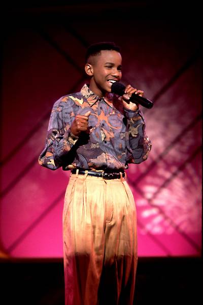 Classic '90s Vibes  - Tevin Campbell is the epitome of the '90s music scene, from his high top haircut to his belted chinos and print collared shirt. His voice rings with '90s nostalgia and timeless innocence. The good ol' days! (Photo: Paul Natkin/WireImage)