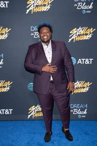 Melvin Crispell III happily made his appearance on the blue carpet in a plum-colored suit. - (Photography By Gip III for Central City Productions) (Photography By Gip III for Central City Productions)