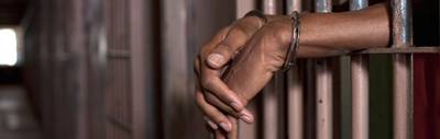 /content/dam/betcom/images/2013/08/Health/081213-health-prison-jail-bars-cell-hands.jpg