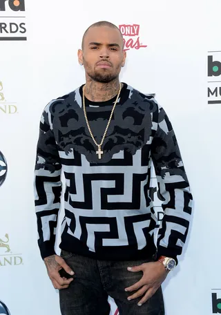 Chris Brown firing back comments at Wendy Williams and Perez Hilton:&nbsp; - “Flunkies! I can’t take advice from two buff chicks when one can’t stand to look at herself without plastic surgery and the other is forever on his period.”  (Photo: Jason Merritt/Getty Images)