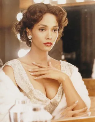 Halle Berry in Introducing Dorothy Dandridge (1999) - Berry not only bears a striking physical resemblance to Dorothy Dandridge, whom she portrayed in this 1999 television movie, the stars' personal lives show several parallels as well. Like Dandridge, Berry was born in Cleveland, Ohio. Dandridge was the first Black woman to be nominated for an Oscar; Berry was the first to win one. And Berry was born almost exactly one year after Dandridge died. For her role as the 1950s beauty, Berry was nominated for several awards, including a Golden Globe.  (Photo: Courtesy of HBO)