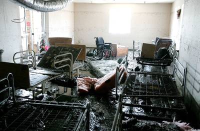Tragedy - A wheelchair and hospital beds covered in mud and debris sit in a room at the St. Rita's Nursing Home Sept. 14, 2005, in St. Bernard, Louisiana. The owners of St. Rita's Nursing home, Mable and Salvador Mangano, were formally charged with 34 counts of negligent homicide after they allegedly failed to evacuate patients at the home prior to Hurricane Katrina. Thirty-four people died after they drowned in the rising flood waters. (Photo: Justin Sullivan/Getty Images)