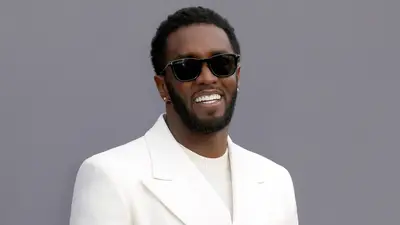 Diddy shines in an all-white suit at the 2022 Billboard Music Awards.