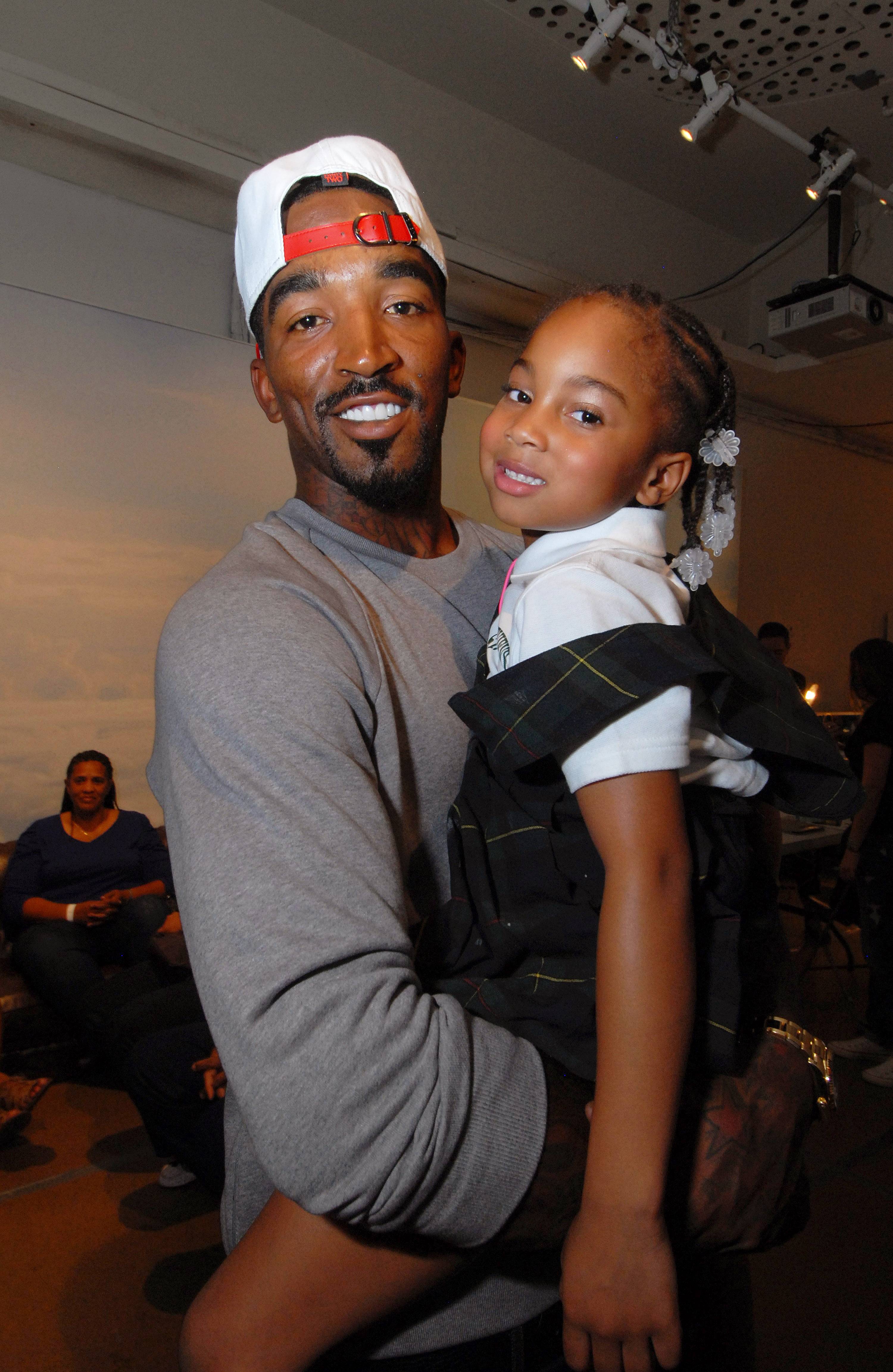 Cavs' J.R. Smith holds premature baby girl for first time in