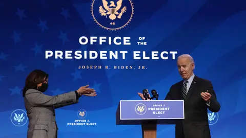 WILMINGTON, DELAWARE - JANUARY 16:  U.S. President-elect Joe Biden (R) and U.S. Vice President-elect Kamala Harris (L) gesture during an announcement January 16, 2021 at the Queen theater in Wilmington, Delaware. President-elect Joe Biden has announced key members of his incoming White House science team.  (Photo by Alex Wong/Getty Images)