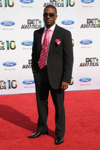 Ray J - Ray J was suave in a black pinstriped suit and matching pink shirt, tie and pocket square.(Photo: Gregg DeGuire/PictureGroup)