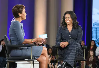 Sophisticated&nbsp;In Pinstripes&nbsp; - Robin Robert's interviews our former first lady Michelle Obama live in Chicago for her Becoming book tour at Good Morning America (Nov. 13). Michelle looked sophisticated in a pinstripe Jonathan Simkhai suit with black heeled booties. (Photo: Lorenzo Bevilaqua/ABC via Getty Images)&nbsp;