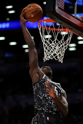 Going Up on a Friday - Gorgui Dieng put the World in the palm of his hands on this dunk and the U.S. didn't like it.&nbsp;(Photo: Elsa/Getty Images)