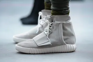 Yeezy 750 Boost - Kanye unveiled in full the result of his new collaboration with sporting brand Adidas: the Adidas Originals x Kanye West Yeezy 750 Boost. Only 9000 of them have been produced and are already being sold on the Black market for a marked up price of up to $2000.(Photo by Kevin Mazur/Getty Images for adidas)