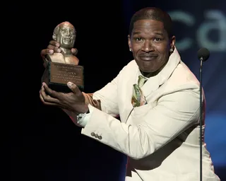 Caught In the Act - Musician turned actor turned musician Jamie Foxx accepts the Quincy Jones Award onstage at the 20th Annual Soul Train Awards further showcasing the breadth and depth of African-Americans' mutilfaceted talent and perpetuating the vision Don Cornelius had to the show.&nbsp;(Photo: Vince Bucci/Getty Images)