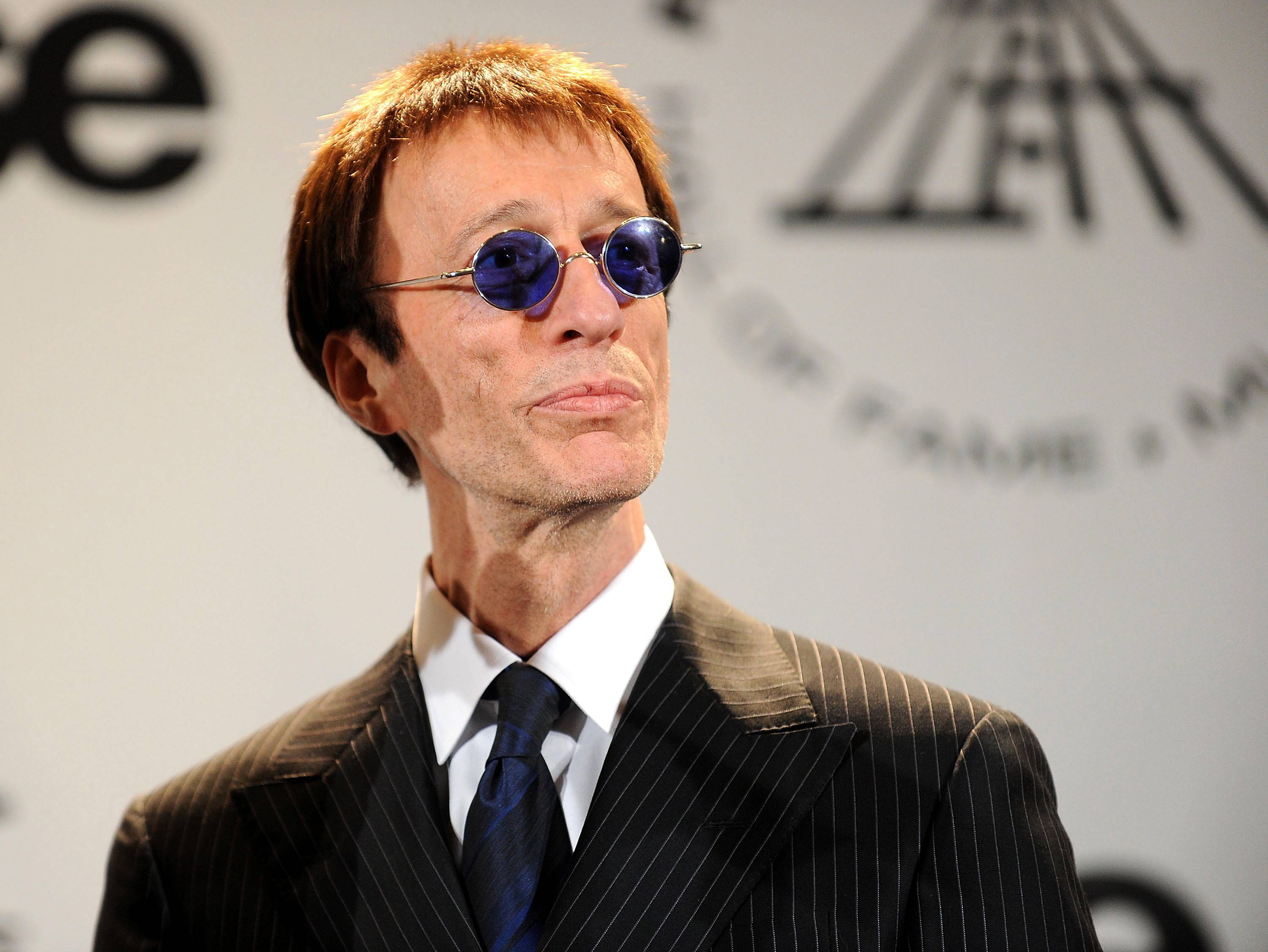 Robin Gibb: 12/22/49–5/20/12 - Music lost a legend on May 20, when former Bee Gee Robin Gibb passed away after a tough battle with cancer. To honor the blue-eyed soul icon's contributions to pop, disco, funk, rock, R&amp;B and more, the BET Awards is taking a look back at his life and legacy.  (Photo: Stephen Lovekin/Getty Images)