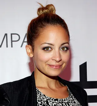 Nicole Richie - Or take a twist on the traditional bun and pile your hair on top of your head and fashion it into a top knot: a style that Hollywood beauties like Nicole Richie frequently rock.  (Photo: Marc Andrew Deley/WireImage/Getty Images)