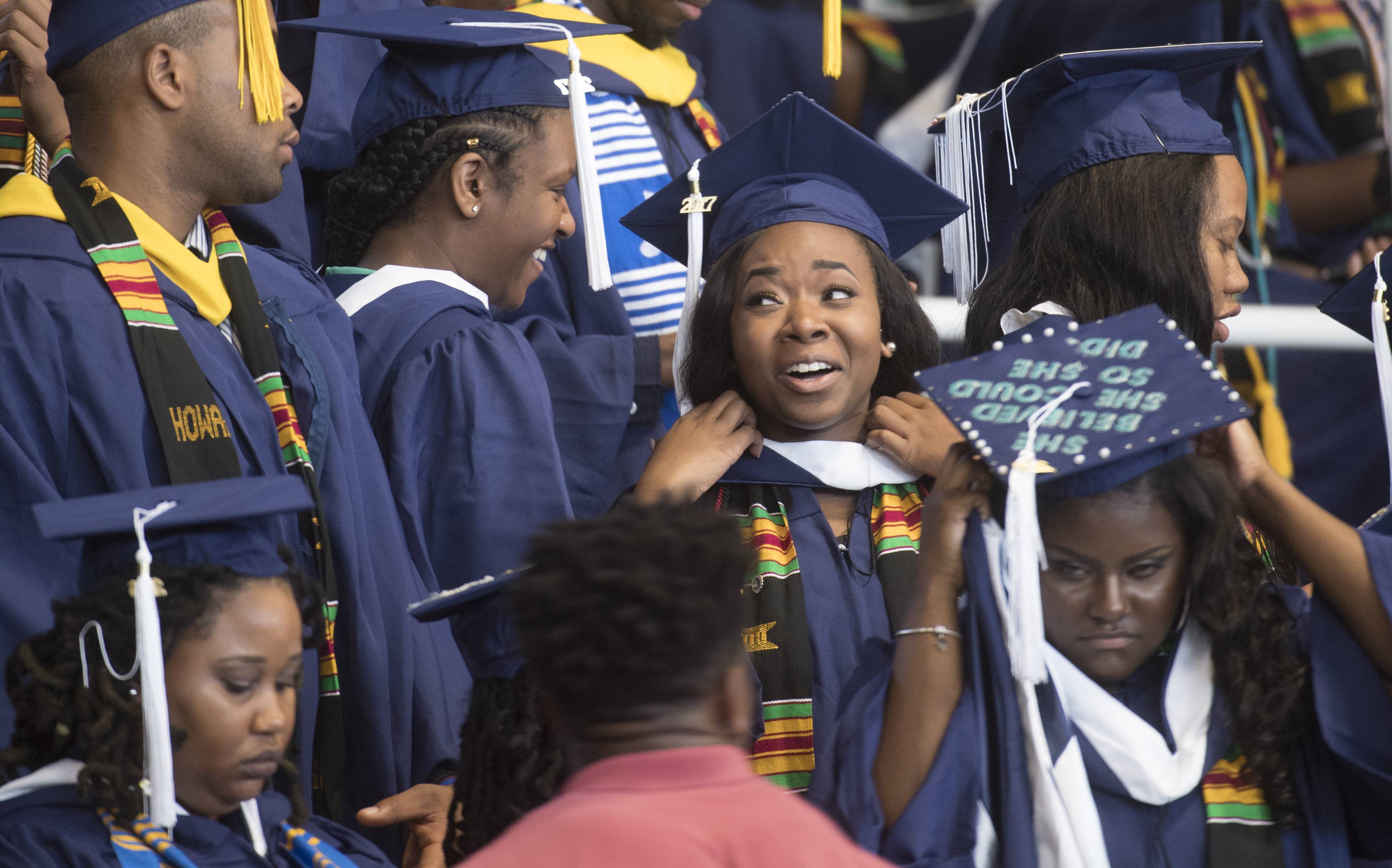 WASHINGTON DC - MAY 13:
Angel C. Dye (center) was able to  receive her undergraduate degree from the College of Arts and Sciences thanks to donors who stepped in to help. Dye celebrates  on the campus of  Howard University  in Washington, DC on May, 13, 2017.
In 2016, Angel Dye was trying to pursue her Howard University education, but like scores of other students at the prominent, financially strapped HBCU, she owed thousands, and had been kicked out of her dorm room and still took classes on the down low. A year later Dye receives her degree today,  with the help of donors who read her story  and is headed to graduate school. 
 (Photo by Marvin Joseph/The Washington Post via Getty Images)
