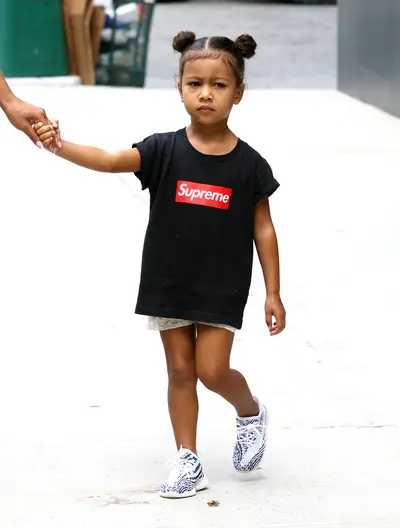 Too Cute - North West was spotted out with her mom in a Supreme top and Princess Leia hairstyle while out in SoHo, New York City. (Photo: Brian Flannery, PacificCoastNews)