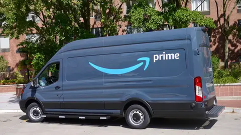 View of an Amazon delivery van with an Amazon Prime logo parked at an apartment complex in downtown Chicago, Illinois, April 2019. (Photo by Interim Archives/Getty Images)