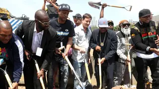 NEW YORK, NEW YORK - MAY 20: Vin Rock, Cutman LG, Peter Bittenbender, Nas, Paradise Gray, and LL Cool J attend the Universal Hip Hop Museum Groundbreaking Ceremony held in Bronx Point on May 20, 2021 in New York City. (Photo by Johnny Nunez/WireImage)