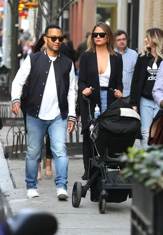 John Legend and Chrissy Teigen - John Legend and Chrissy Teigen were spotted taking baby Luna for a stroll around Manhattan's Soho neighborhood. (Photo: LGjr-RG, PacificCoastNews)