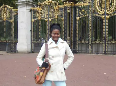 London - A black and gold gate that fly makes one wonder what the heck is inside!&lt;BR&gt;Shavon looks nice, too!