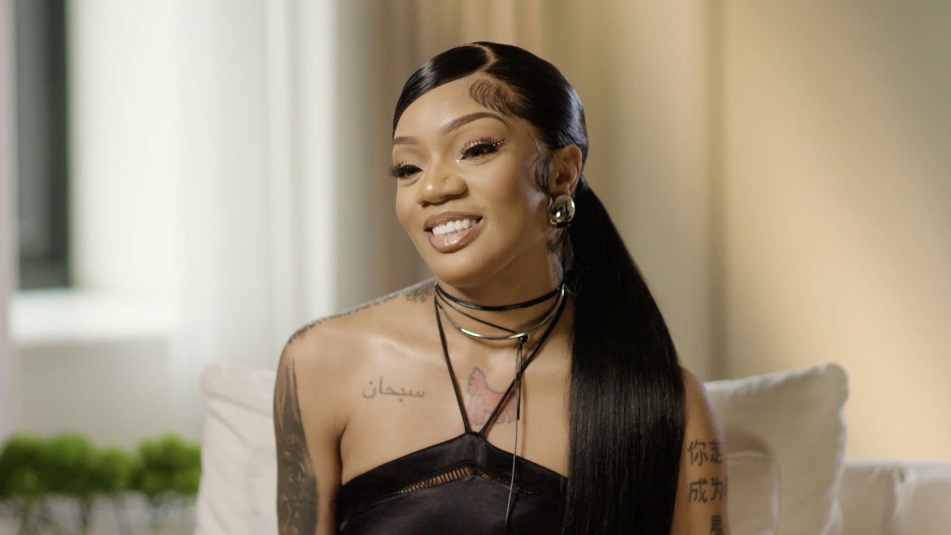 GloRilla in a black dress.