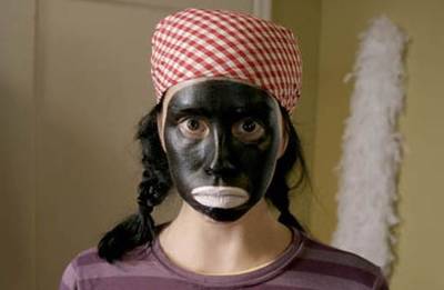 Sarah Silverman on &quot;The Sarah Silverman Show&quot; - In a skit that was a direct examination of racism,&nbsp;Silverman covered her face in charcoal and called herself Queen Latifah after getting told to walk a mile in a Black person's shoes.&nbsp; (Photo: The Sarah Silverman Show via Comedy Central)
